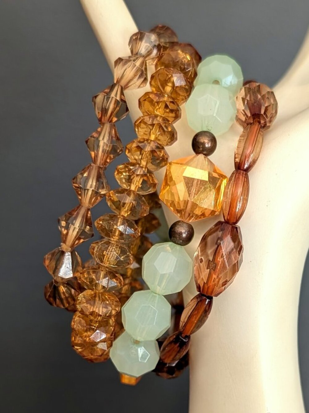 Layering honey, pale green, orange and cognac beaded stretch bracelets